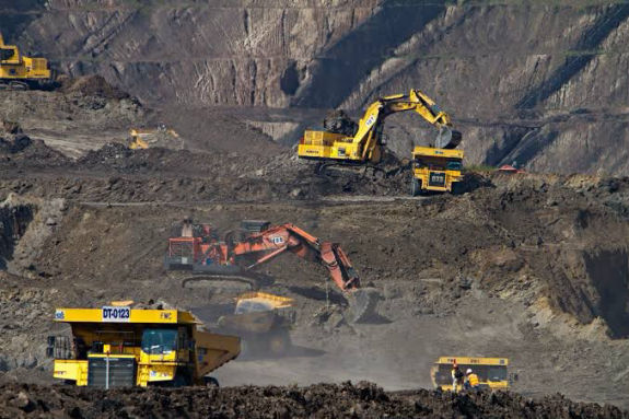 Coal held in a gloved hand
