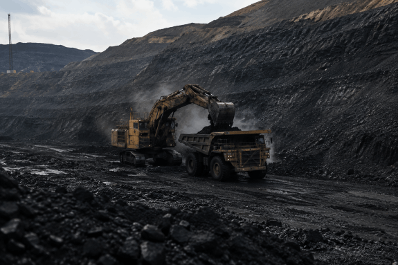 Excavator and haul truck at a coal mine